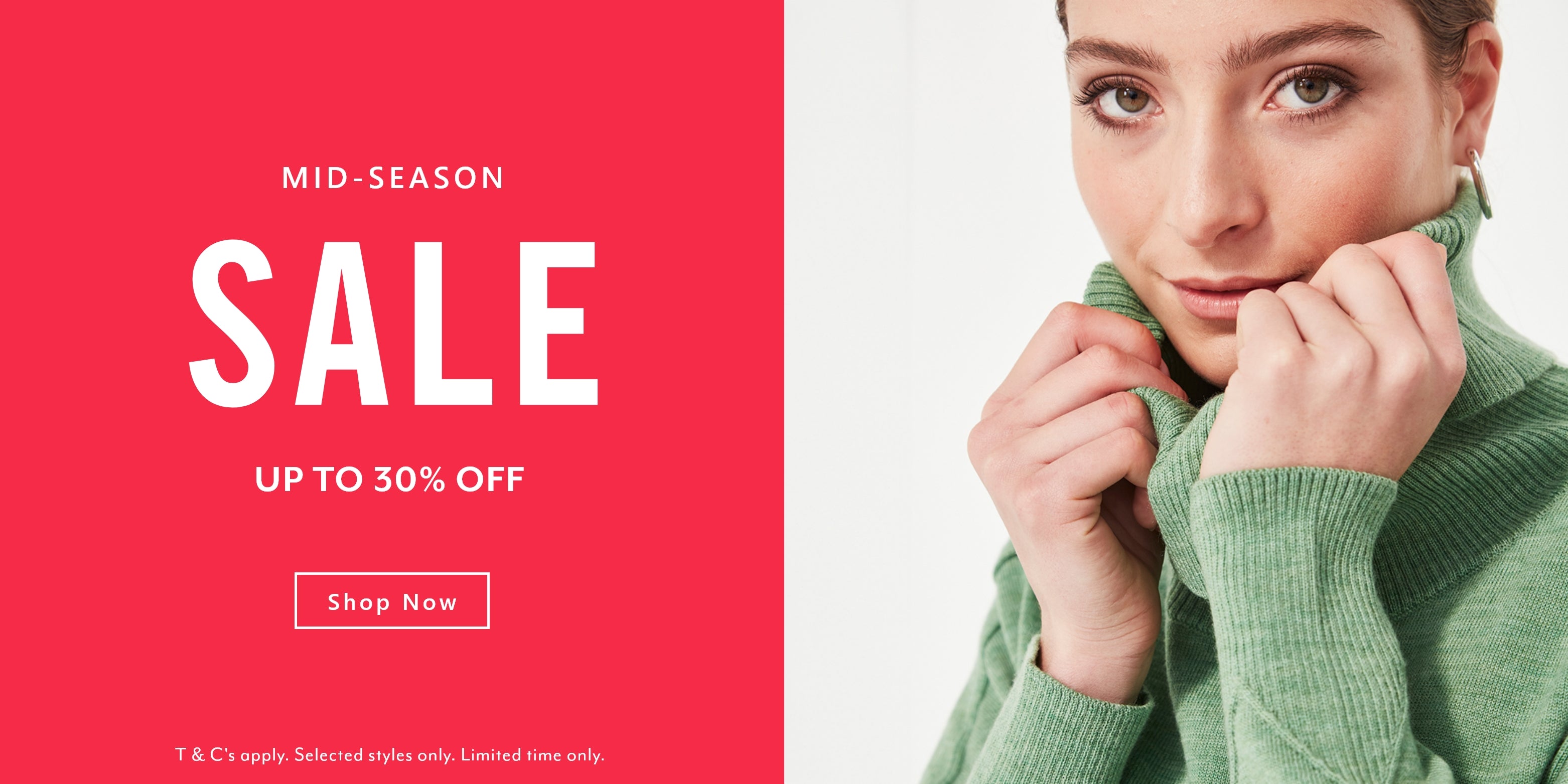 Woman wearing a green sweater by Verge with a red sale banner on the left side.