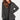Woman wearing a gray checkered blazer by Verge against a white background