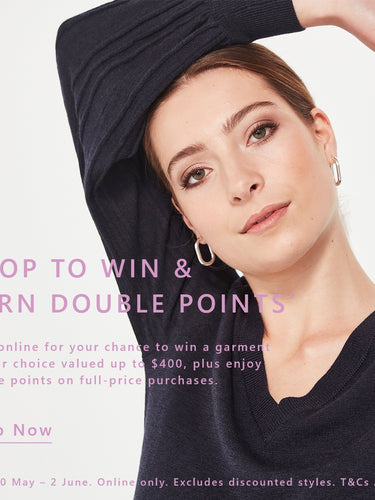 Woman wearing a black long-sleeve top by Verge with promotional text on a light gray background